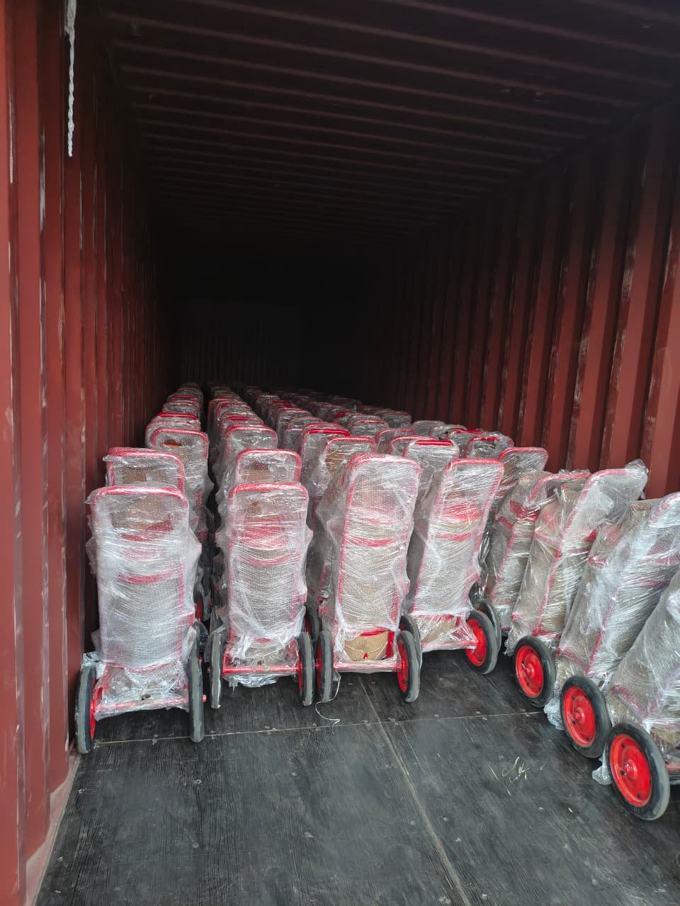 Wheeled fire extinguishers packed in a container